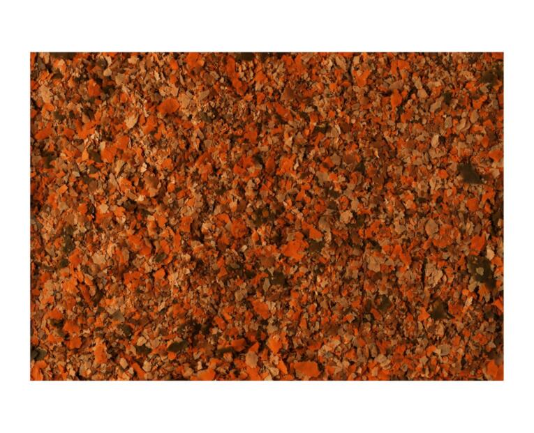 Detalhe macro dos flocos de TetraMin Flakes comida para peixes tropicais.